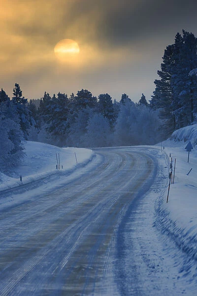 Setting sun photographed along a road near Muonio, Lapland, Finland