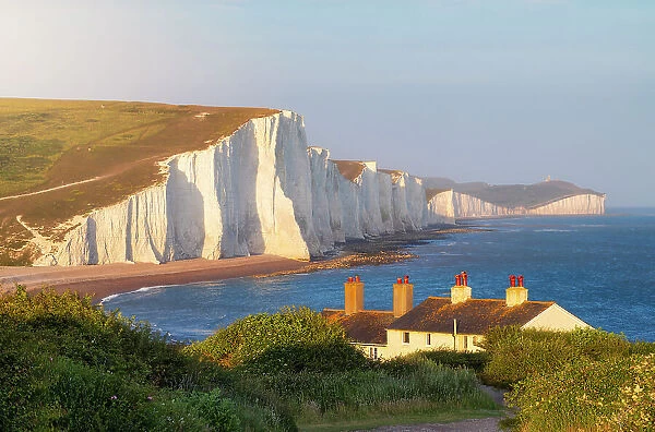 Seven Sisters and Coastguard Cottages at sunset, Sussex, England, United Kingdom