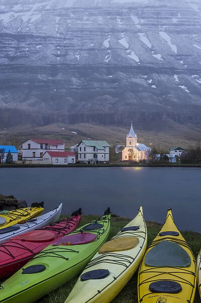 Seydisfjordur, eastern fjords, Iceland. Church and moored kayaks