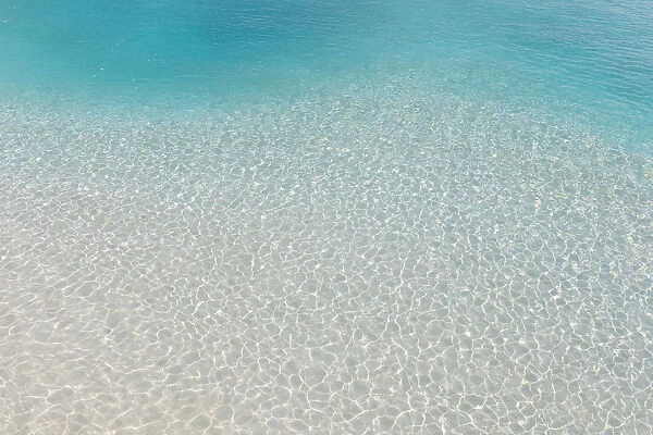 Shallow lagoon by the beach on a tropical island in the South Male Atoll, Maldives