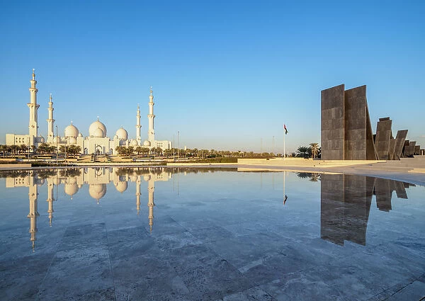Sheikh Zayed bin Sultan Al Nahyan Grand Mosque and Wahat Al Karama Monument at sunrise
