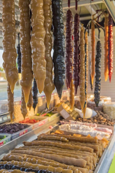Shushukos for sale in Larnaca Cyprus. Shushukos is a dried grape jelly and walnut sweet