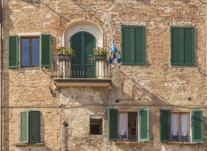 Framed Print : Siena, Tuscany, Italy, Europe. A contrada flag on a balcony Framed Print : Siena, Tuscany, Italy, Europe. A contrada flag on a balcony