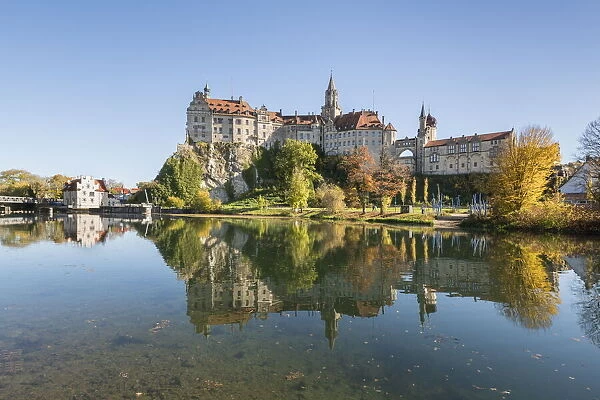 Sigmaringen castle reflects itself on the Danube river. Sigmaringen, Baden-Wurttemberg, Germany