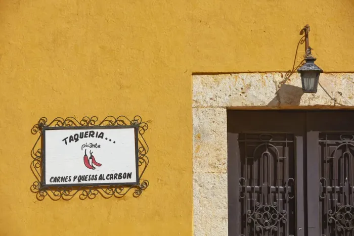 Framed Print : The signboard of a traditional Taqueria'restaurant in a street of Izamal, Yucatan, Mexico. Izamal is known in Yucatan as the Yellow City, as most of its buildings are painted yellow Framed Print : The signboard of a traditional Taqueria'restaurant in a street of Izamal, Yucatan, Mexico. Izamal is known in Yucatan as the Yellow City, as most of its buildings are painted yellow