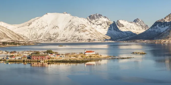 Framed Print : Sildpollneset peninsula with its church and snowcapped mountains in the background Framed Print : Sildpollneset peninsula with its church and snowcapped mountains in the background