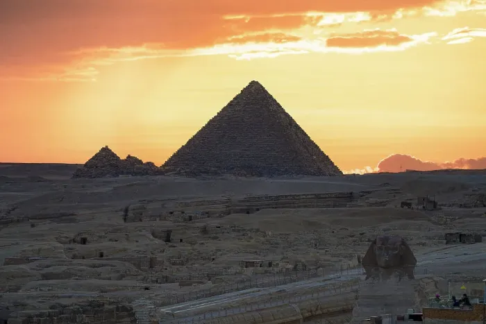 Framed Print : Silhouette of Giza pyramids and The Sphinx under a fiery sky at sunset, Cairo, Egypt Framed Print : Silhouette of Giza pyramids and The Sphinx under a fiery sky at sunset, Cairo, Egypt