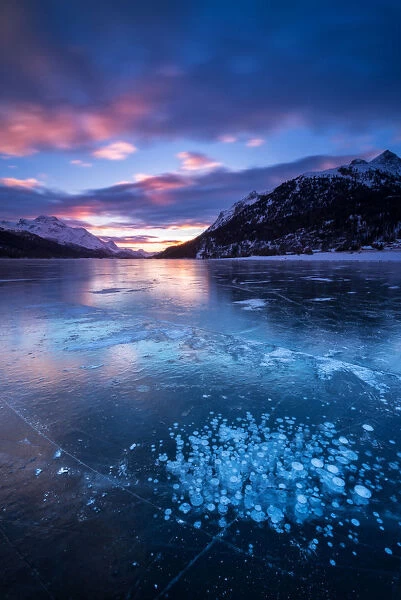 Silvaplana Lake, Sankt Moritz, Switzerland. Sunset over the frozen lake