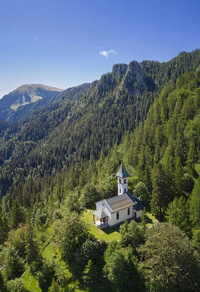 Silvestri church and the Mount Pora in a summer day. Presolana pass, Angolo Terme