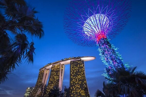 Singapore, Gardens By The Bay, Super Tree Grove and Marina Bay Sands Hotel, dusk