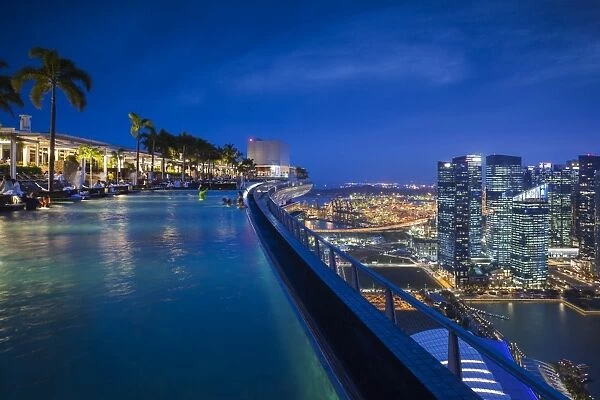 Singapore, Marina Bay Sands Hotel, rooftop swimming pool, dusk