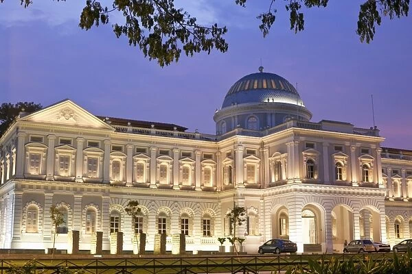Singapore, Singapore, Bras Basah. The National Museum of Singapore illuminated at dusk