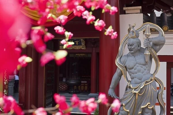 Singapore, Singapore, Chinatown. Guardian statue at the Buddha Tooth Relic Temple