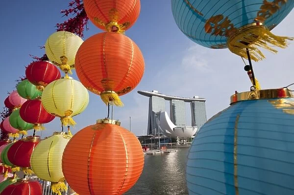 Singapore, Singapore, Marina Bay. The Marina Bay Sands Hotel viewed through Chinese New Year decorations