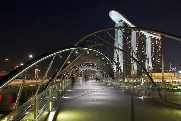 Singapore, Singapore, Marina Bay. The Helix Bridge and Marina Bay Sands Singapore
