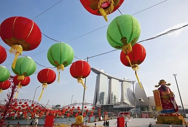 Singapore, Singapore, Marina Bay. River Hongbao Chinese New Year decorations with Marina Bay Sands Hotel