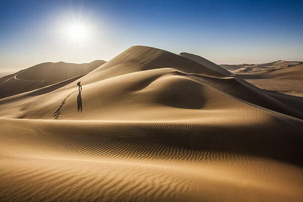 Single person walking over sand dunes near Swakopmund, Namibia