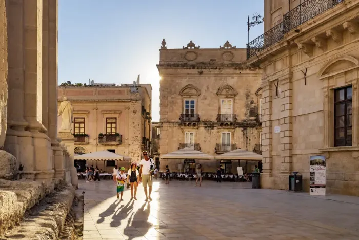 Framed Print : Siracusa, Sicily. People walking on Duomo square near the Cathedral at sunset Framed Print : Siracusa, Sicily. People walking on Duomo square near the Cathedral at sunset