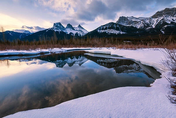 Three Sisters Reflecting in Bow River, Aberta, Canada