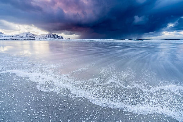 Skagsanden beach after a hailstorm at sunset, Flakstad, Nordland county, Northern Norway