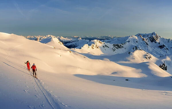 Ski mountaneers during climbing Wisshorn at sunrise - Fluela pass - Switzerland
