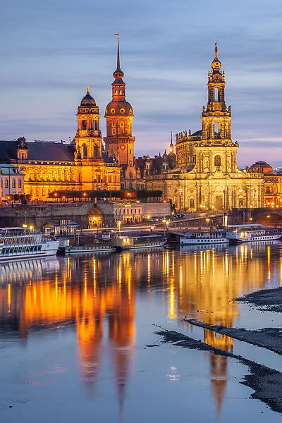 Skyline of Dresden at dusk with Bruehl's Terrace, Academy of Fine Arts, Residential palace, Court Church - Hofkirche and paddle steamer on river Elbe, Dresden, Saxony, Germany