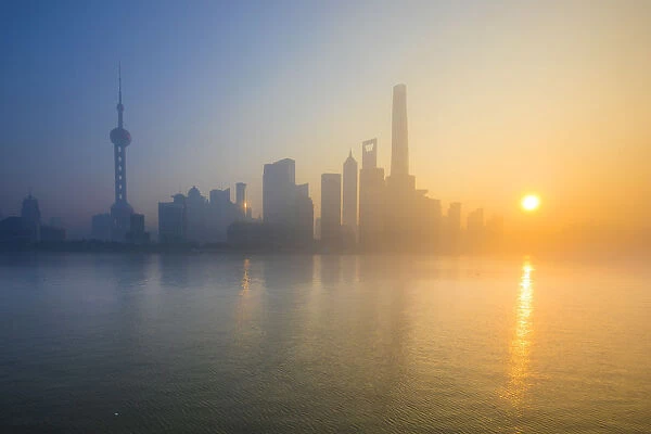 Skyline of Pudong from The Bund on a foggy November morning, Shanghai, China