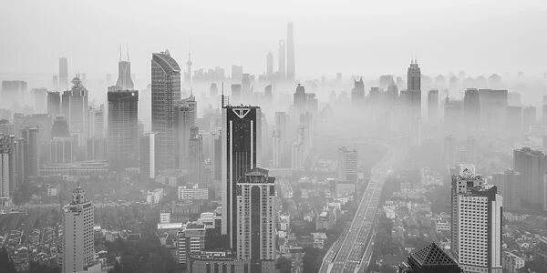 Skyline of Shanghai from Jing An on a foggy November morning, China