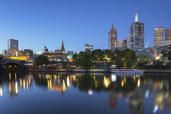 Skyline along Yarra River at dusk, Melbourne, Victoria, Australia