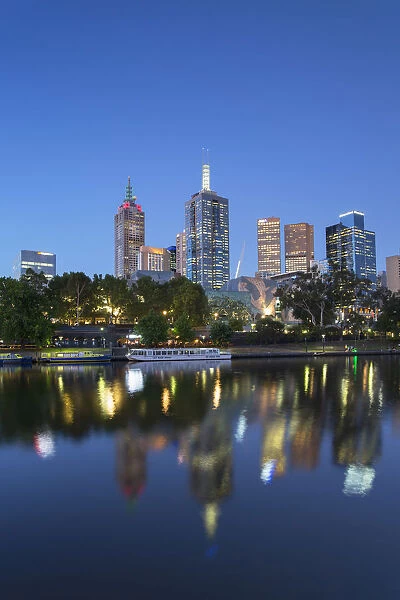 Skyline along Yarra River at dusk, Melbourne, Victoria, Australia