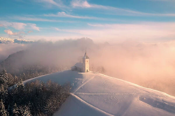 Slovenia, Jamnik, Church of St. Primoz with the Kamnik-Savinja Alps beyond, Gorenjska