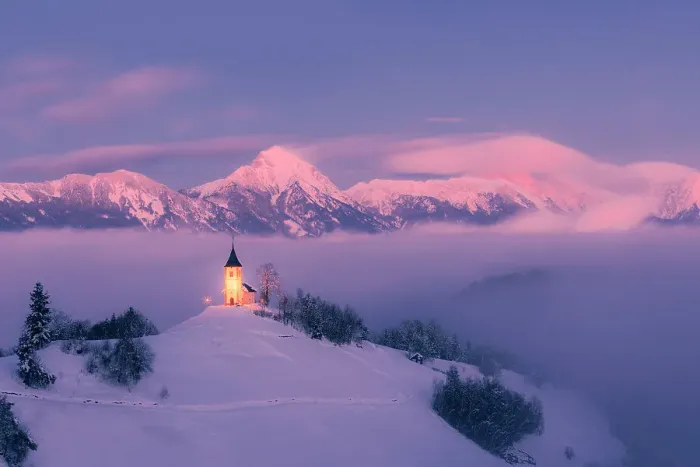 Framed Print : Slovenia, Jamnik, Church of St. Primoz covered with fog at dusk with the Kamnik-Savinja Alps beyond, Gorenjska