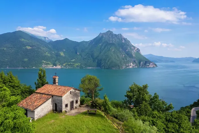 Framed Print : small church of San Lorenzo dominating Lake Iseo in summer. Castro, Iseo Lake, Bergamo district, Lombardy, Italy