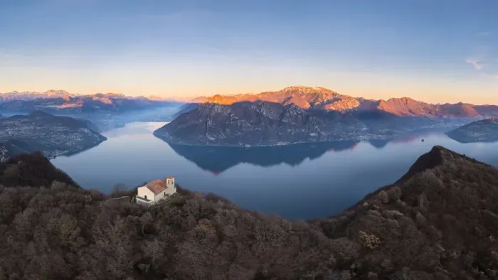 Framed Print : small church of Santuario della Santissima Trinit at the top of a mountain dominating Lake Iseo at sunset. Parzanica, Iseo Lake, Bergamo district, Lombardy, Italy Framed Print : small church of Santuario della Santissima Trinit at the top of a mountain dominating Lake Iseo at sunset. Parzanica, Iseo Lake, Bergamo district, Lombardy, Italy