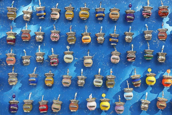Small colorful magnets with the shape of a 'Mate' on sale in a street stand of La Boca, Buenos Aires, Argentina. The 'Mate' is a traditional South American caffeine-rich infused drink
