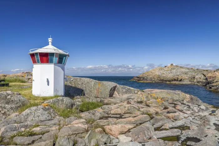 Framed Print : Small lighthouse in the harbor of Landsort on the archipelago island of Oja Framed Print : Small lighthouse in the harbor of Landsort on the archipelago island of Oja