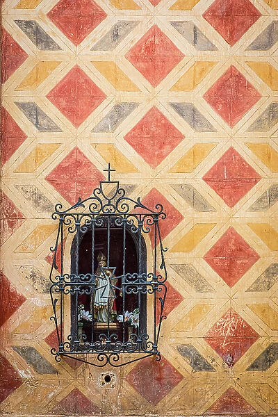 Small religious shrine in a church wall, Malaga City, Andalusia, Spain