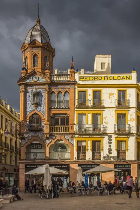 Framed Print : Small square with outdoor cafe in Seville, Andalusia, Spain Framed Print : Small square with outdoor cafe in Seville, Andalusia, Spain