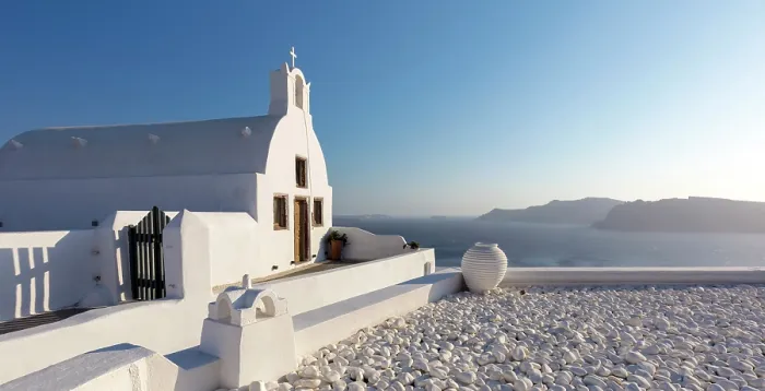 Framed Print : Small traditional Greek whitewashed church with caldera view, Oia, Santorini, Cyclades Islands, Greece, Europe