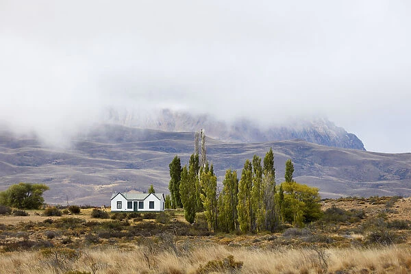 A small traditional house surrounded by the Patagonian landscape