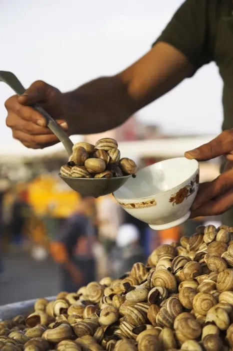 Framed Print : Snails for sale at one of the many food stalls that