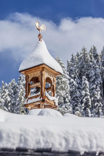 Snow-covered belfry at the Bergkristall hut on the Klausberg, Ahrntal, South Tyrol, Italy