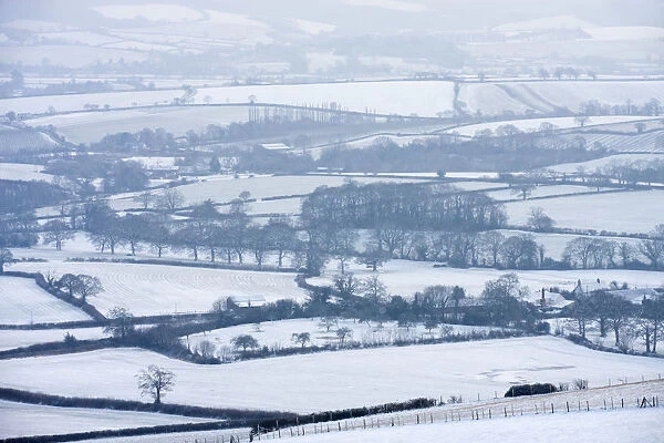 Snow covered mid Devon countryside in Winter near Crediton. February 2009