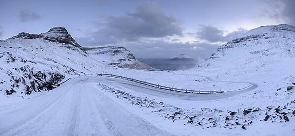 Snow covered mountain road on the Island of Streymoy, Faroe Islands, Denmark, Europe