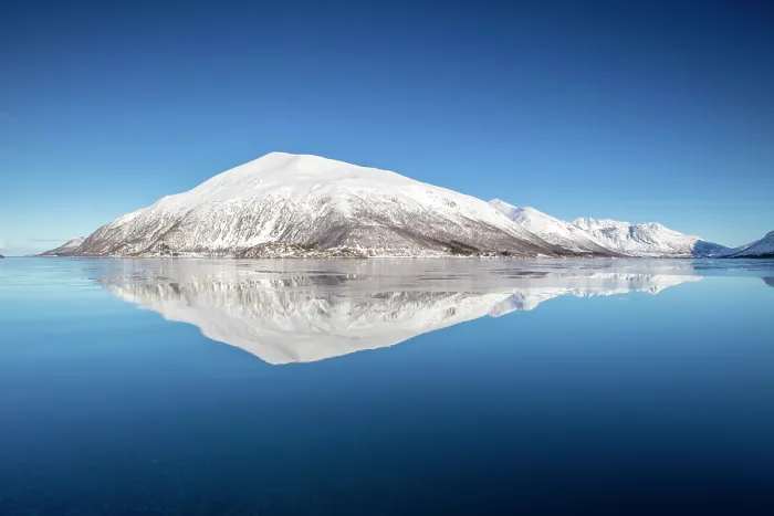 Framed Print : Snow-covered mountains with a perfect reflection in flat calm waters, island of Kvaloya, near Tromso, Norway Framed Print : Snow-covered mountains with a perfect reflection in flat calm waters, island of Kvaloya, near Tromso, Norway