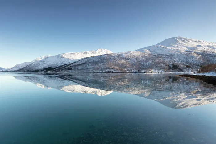 Framed Print : Snow-covered mountains with a perfect reflection in flat calm waters of a fjord, island of Kvaloya, near Tromso, Norway Framed Print : Snow-covered mountains with a perfect reflection in flat calm waters of a fjord, island of Kvaloya, near Tromso, Norway