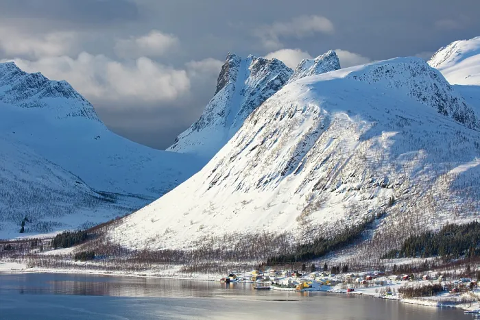 Framed Print : Snow-covered mountains behind the village of Bergsbotn and Bergsfjord, Senja, Troms county, Norway