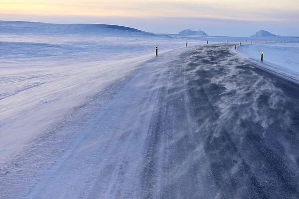 Snow drifts across the main road at Grimsstadir, Iceland