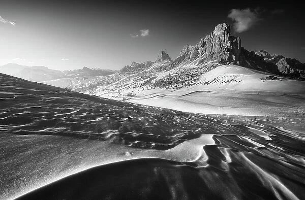 Snow textures creating interesting leading lines at the Giau Pass with the Ra Gusela in the background. Dolomites, Italy