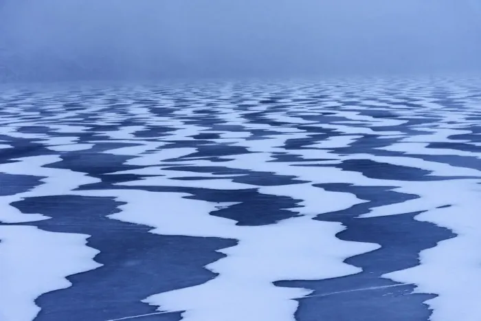 Framed Print : Snow textures shaped by the wind on a frozen lake in the Lofoten islands, Norway